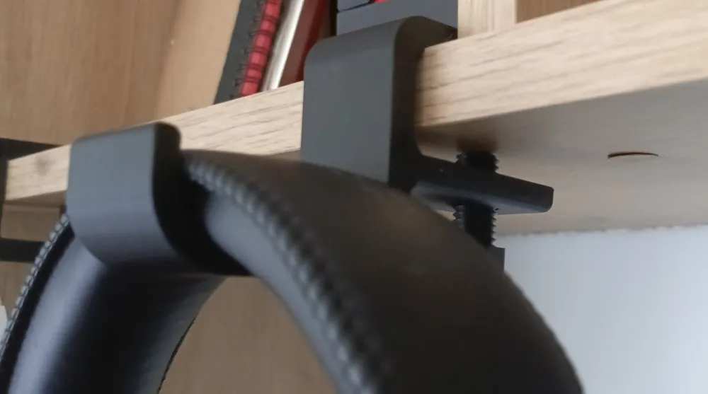 Black 3D printed under-shelf headphone hook with headphones